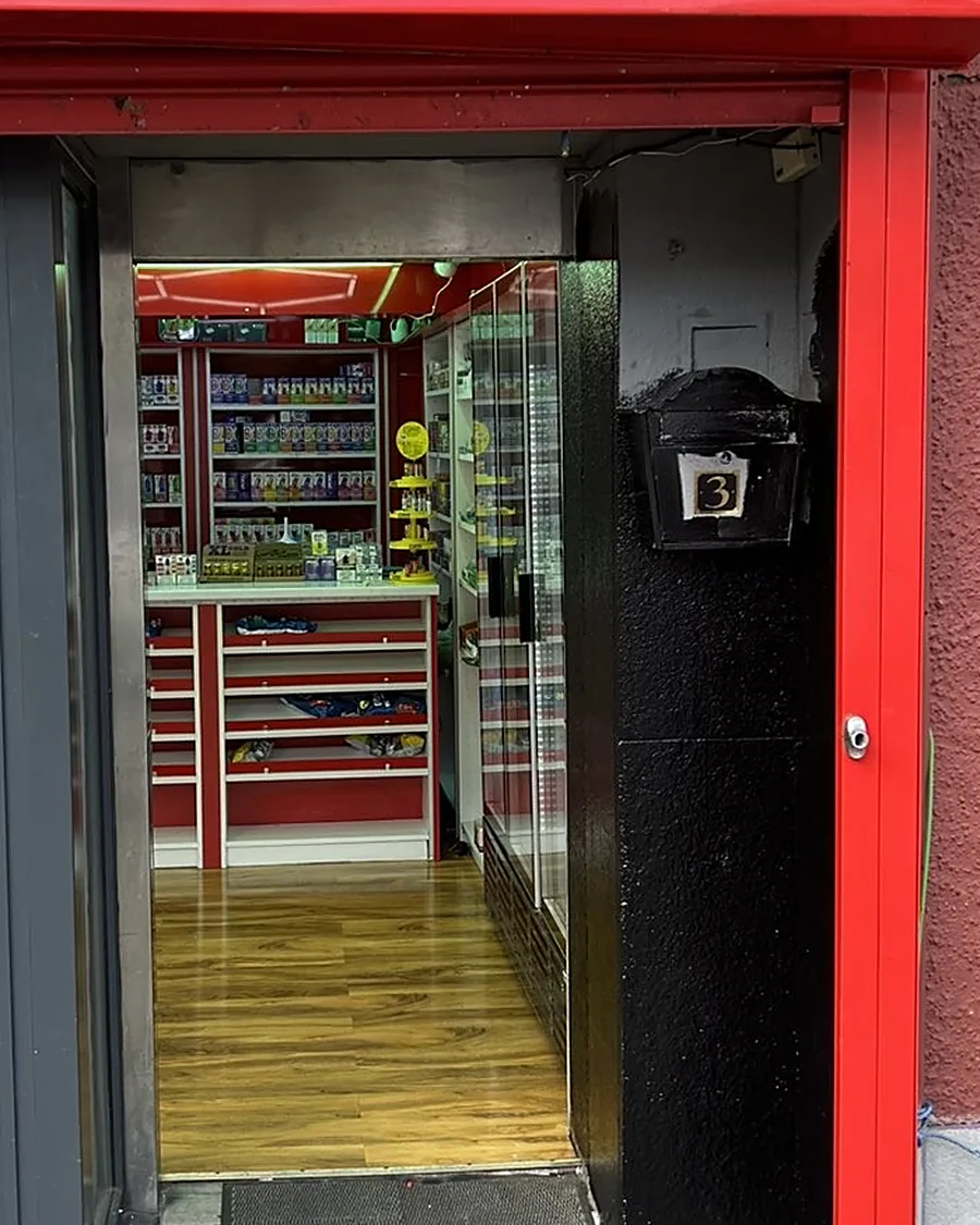 Looking through Bambo's open door to the red and white shelves inside