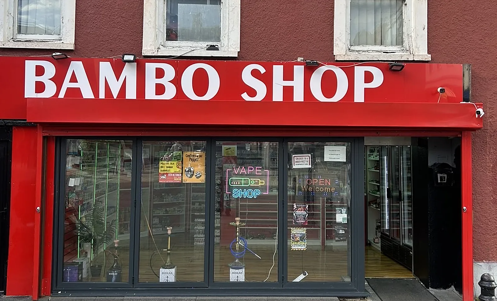 The Bambo Shop frontage in Haverfordwest: a red fascia with white lettering over full-height windows