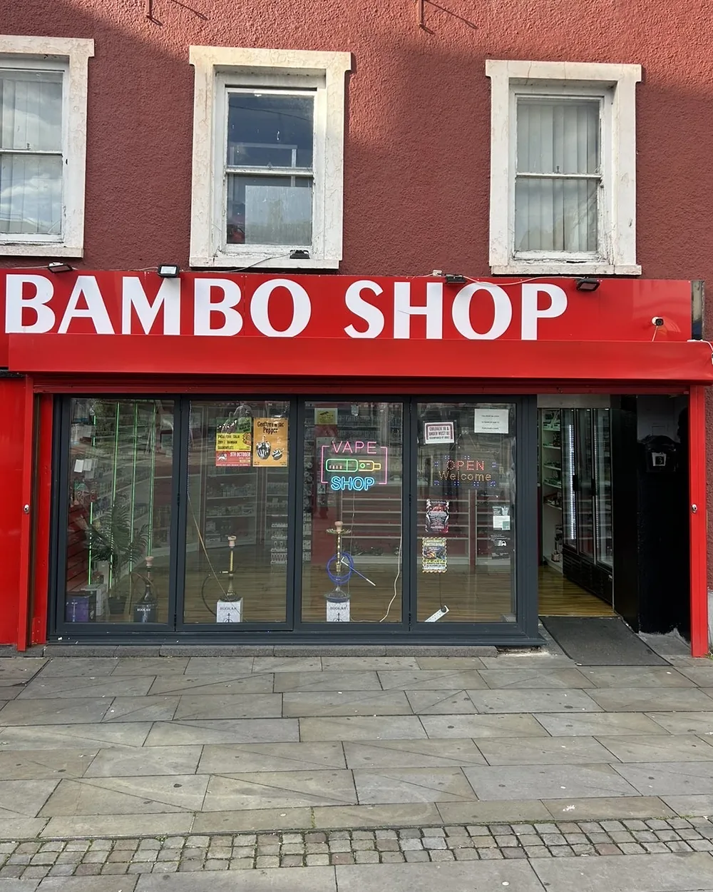 The Bambo Shop frontage: red fascia, white lettering and full-height windows